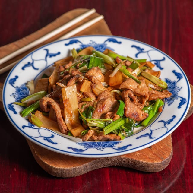 49. Sliced pork with scallions.